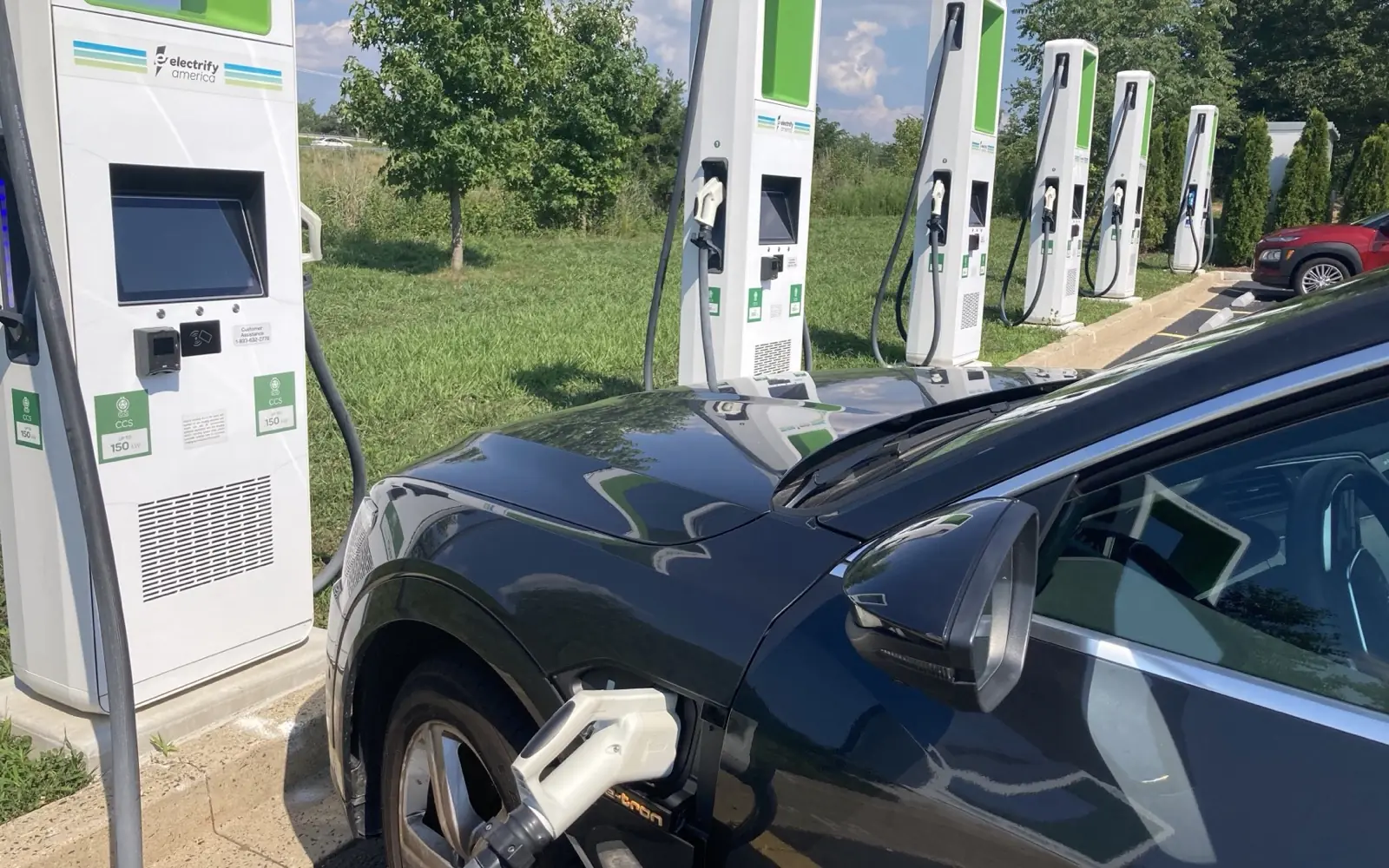 A CCS1 (Combined Charging System) DC fast connector plugged into an electric vehicle.