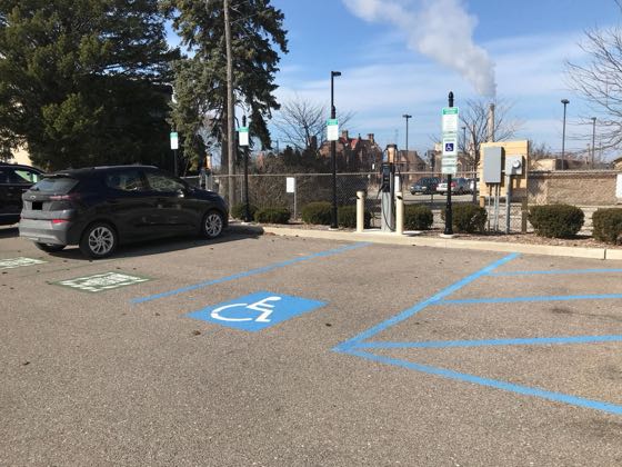 EV charger at 113 W 8th St Parking Lot